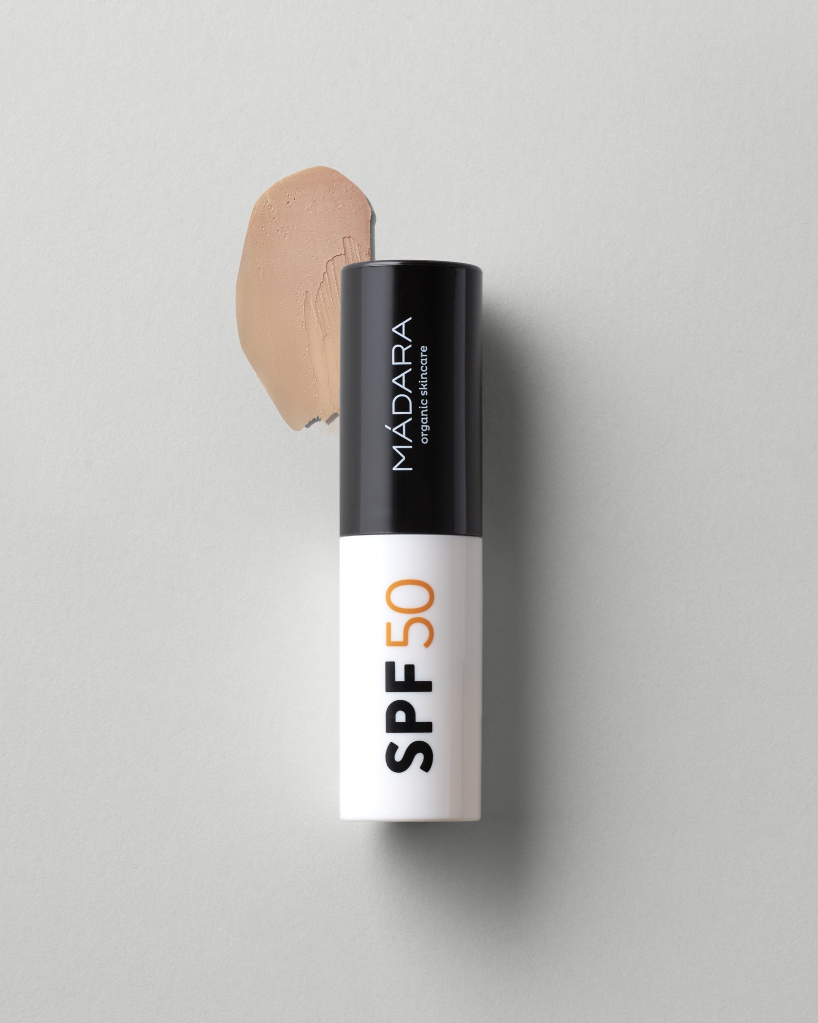 MÁDARA Organic Skincare mineral spf50 sunscreen stick A3433 mineral sunscreen product photo on plain background.