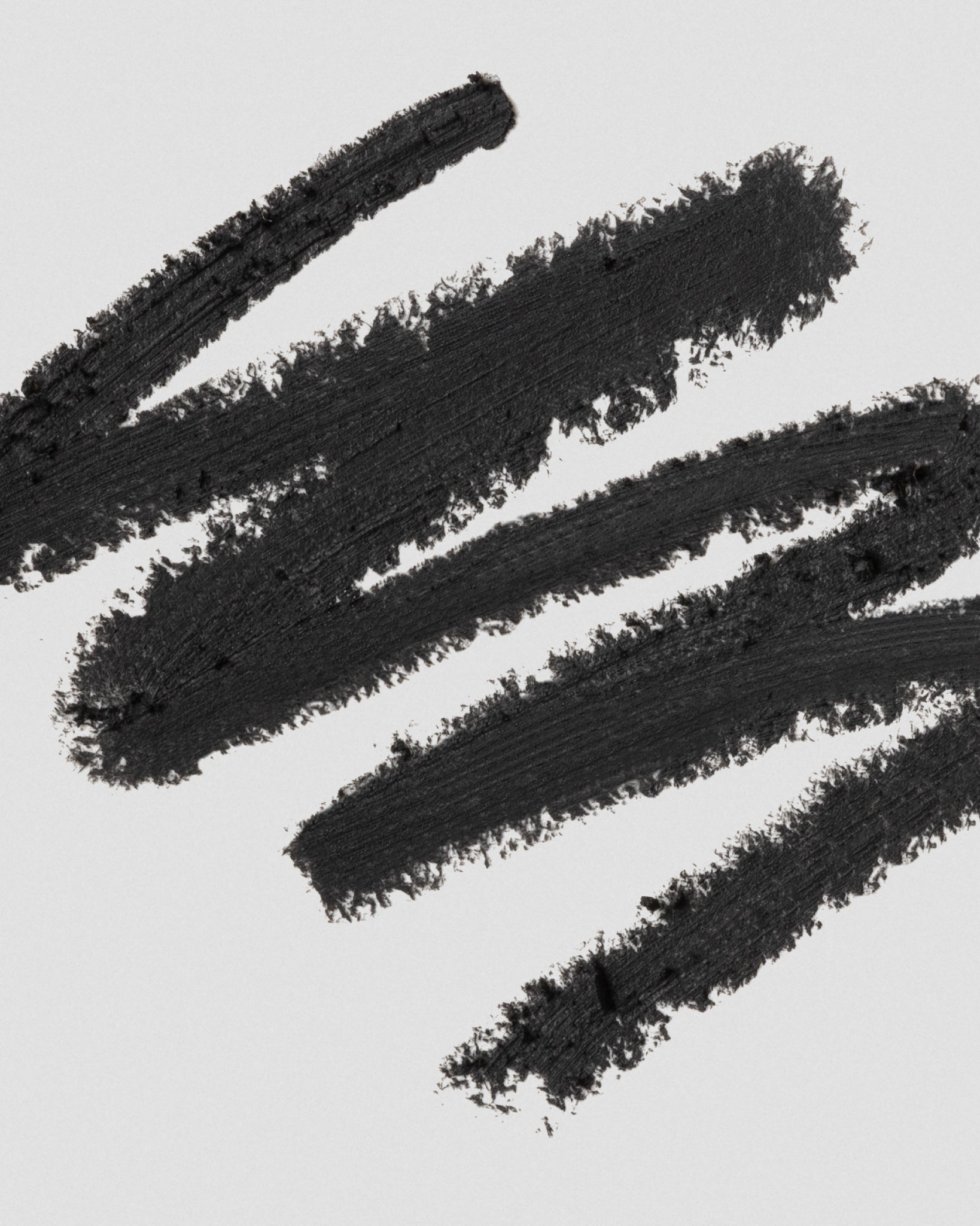 Texture close-up of MÁDARA Organic Skincare eye pencil black A6881 eye contour care �swatch demonstrates consistency and finish.