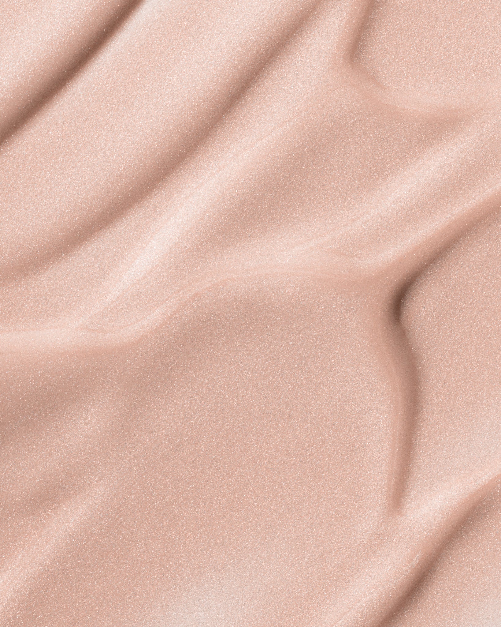 Texture close-up of MÁDARA Organic Skincare may flower A3511 �swatch demonstrates consistency and finish.