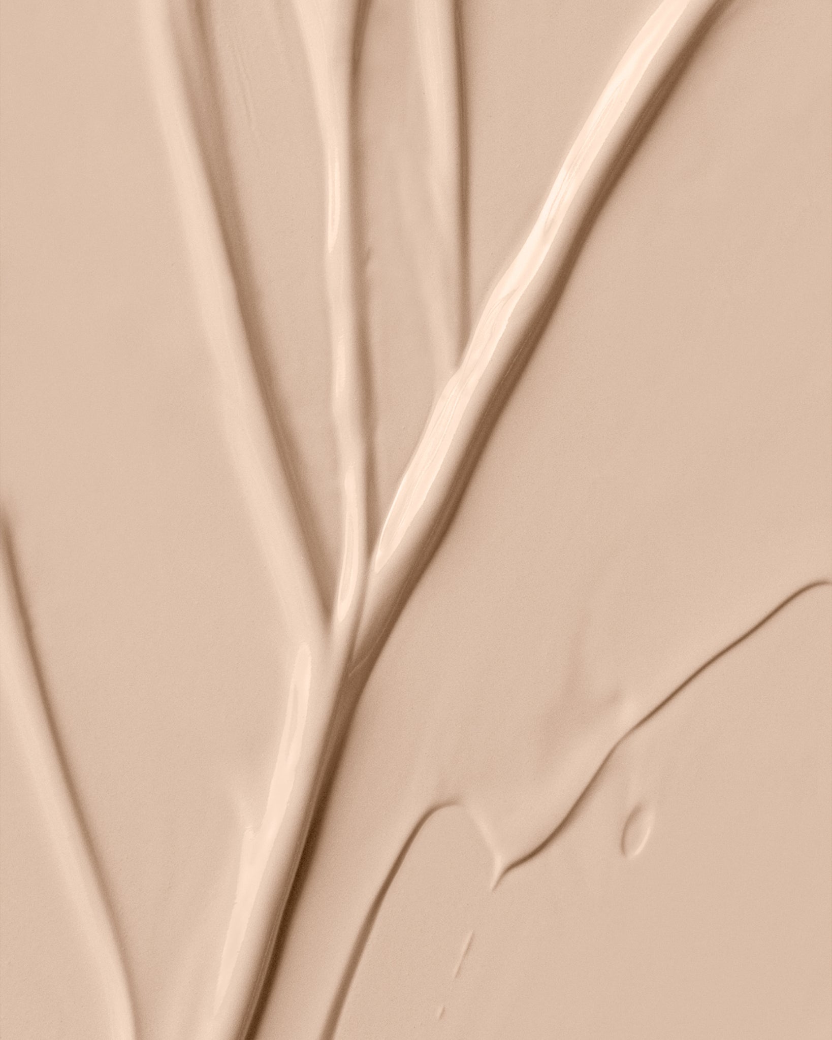 Texture close-up of MÁDARA Organic Skincare skinonym ivory A6082 �swatch demonstrates consistency and finish.