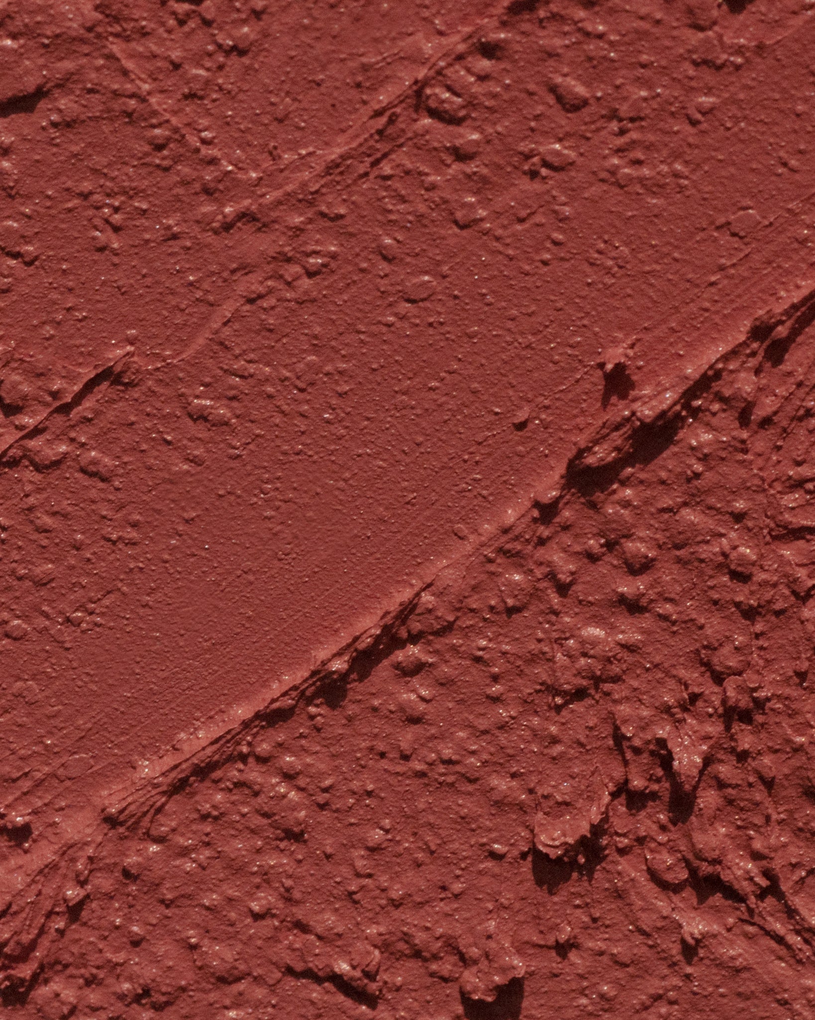 Texture close-up of MÁDARA Organic Skincare velvet wear warm nude A6302 �swatch demonstrates consistency and finish.
