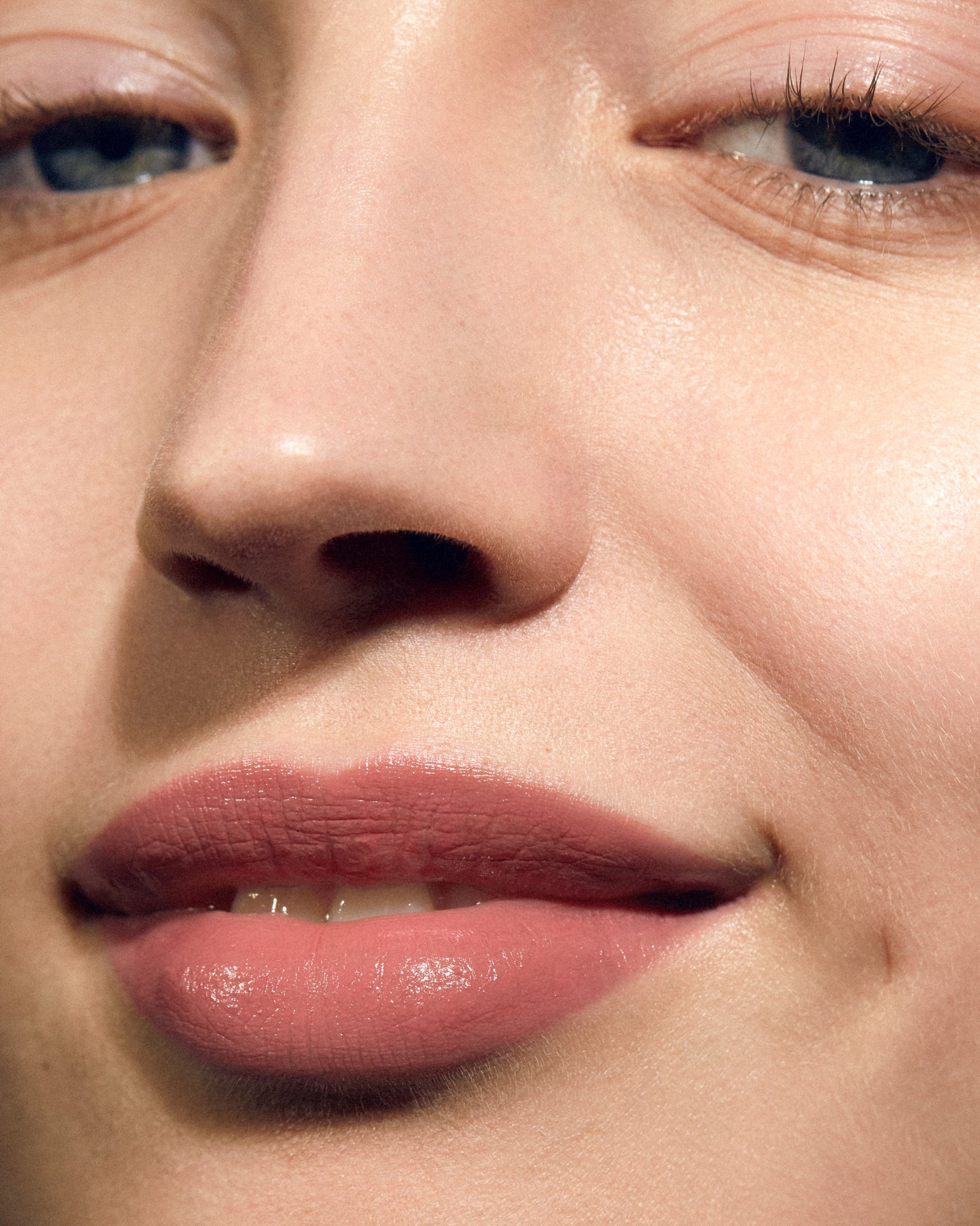 Model wearing MÁDARA Organic Skincare satin shine lipstick flattery on A6501 on skin; close-up portrait shows natural application results.