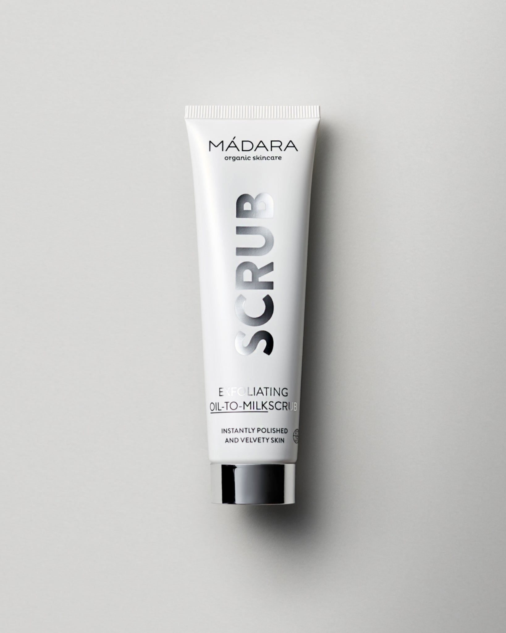 MÁDARA Organic Skincare exfoliating oil to milk scrub A2151 face oil product photo on plain background.