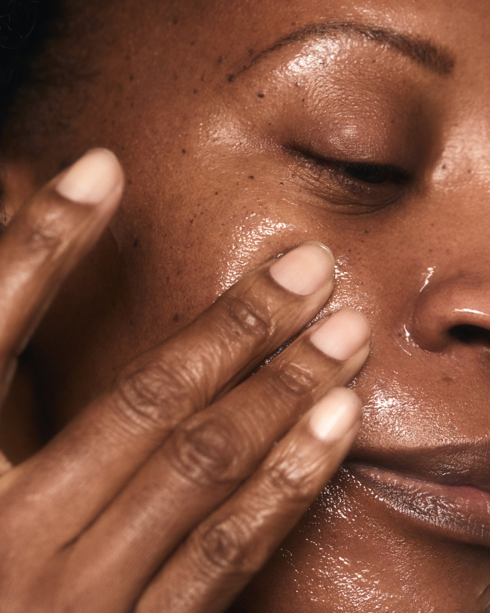 Model wearing MÁDARA Organic Skincare birch water face jelly SM3342 15 gel moisturizer on skin; close-up portrait shows natural application results.