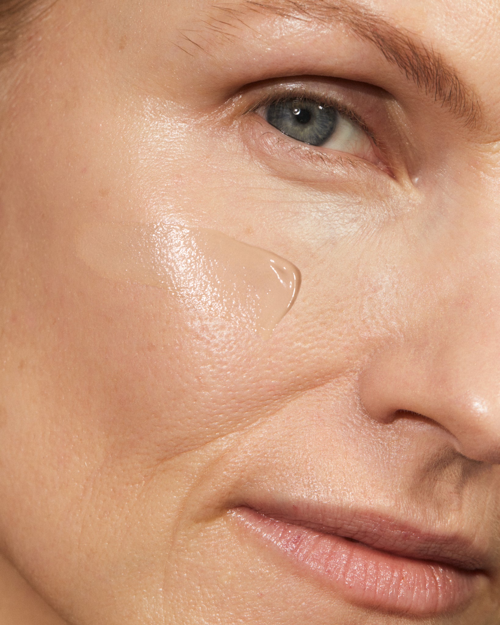 Model wearing MÁDARA Organic Skincare skinonym foundation linen on A6088 foundation on skin; close-up portrait shows natural application results.