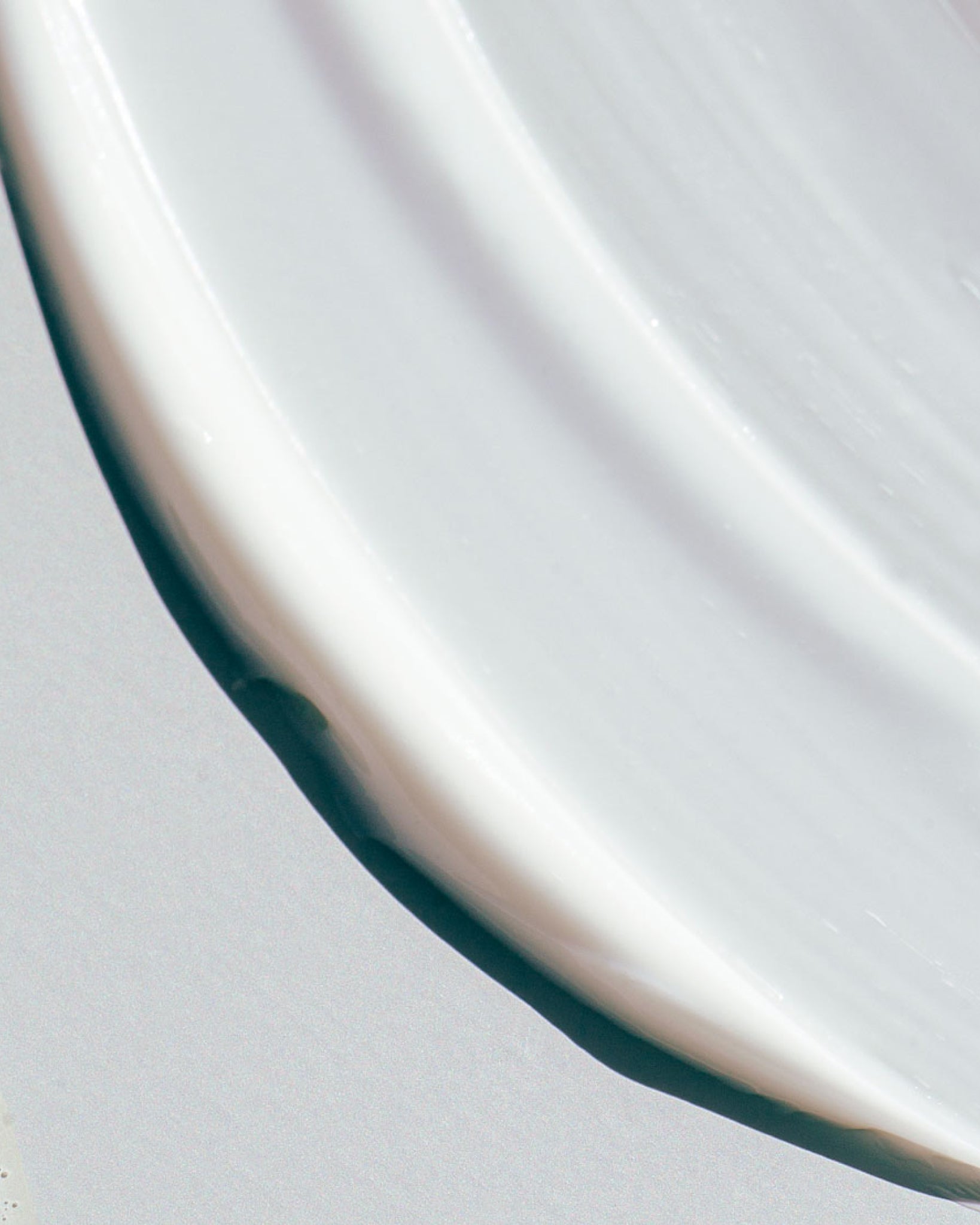 Texture close-up of MÁDARA Organic Skincare kind hydra lotion A4467 lotion �swatch demonstrates consistency and finish.