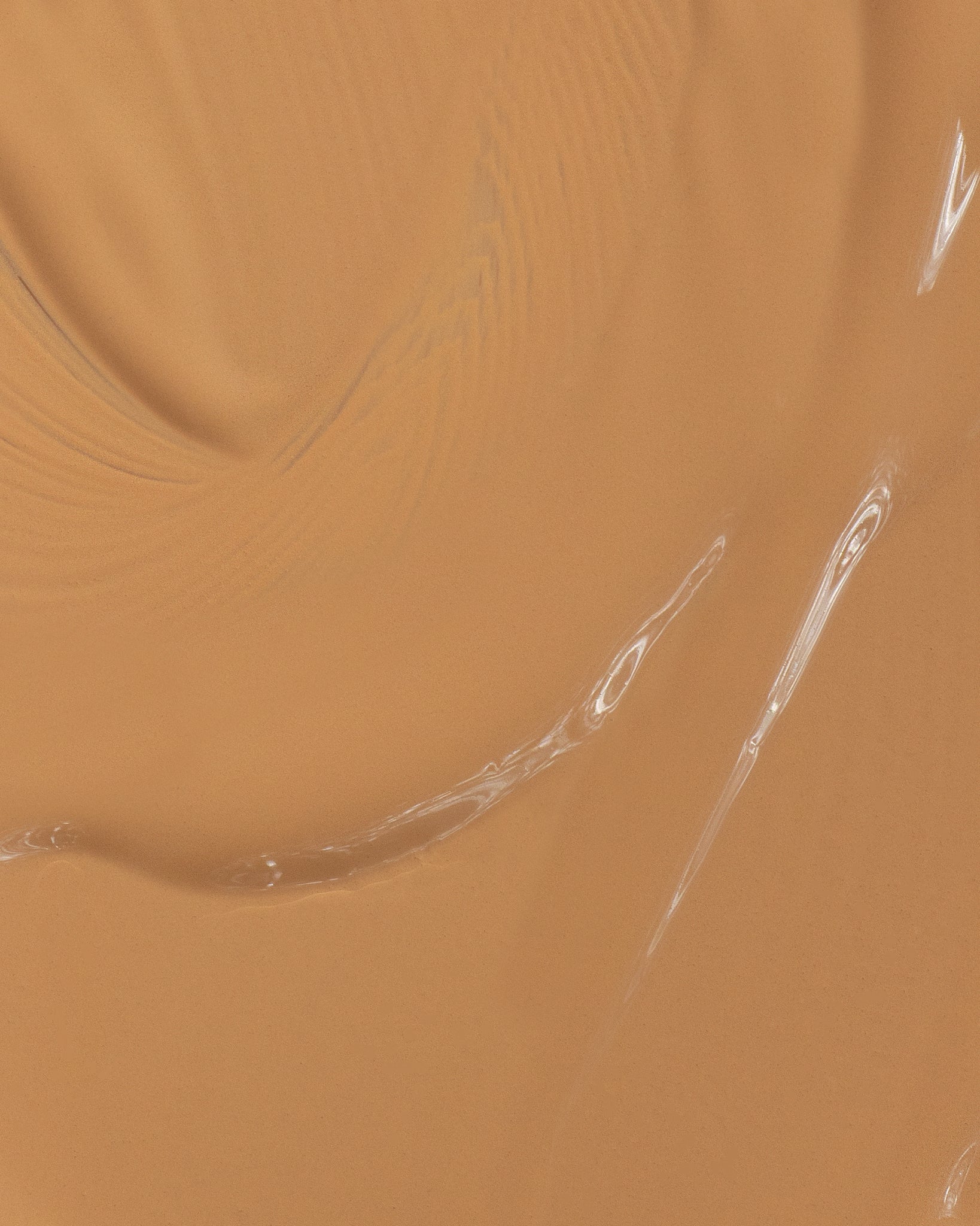 Texture close-up of MÁDARA Organic Skincare skin equal foundation olive A6061 foundation �swatch demonstrates consistency and finish.