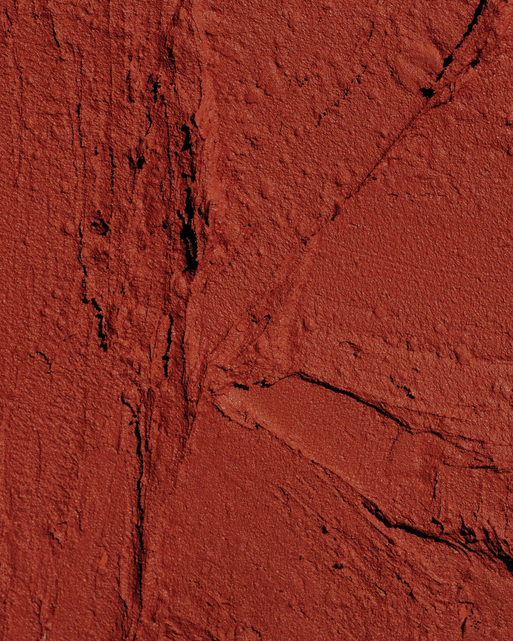 Texture close-up of MÁDARA Organic Skincare velvet wear magma A6303 �swatch demonstrates consistency and finish.