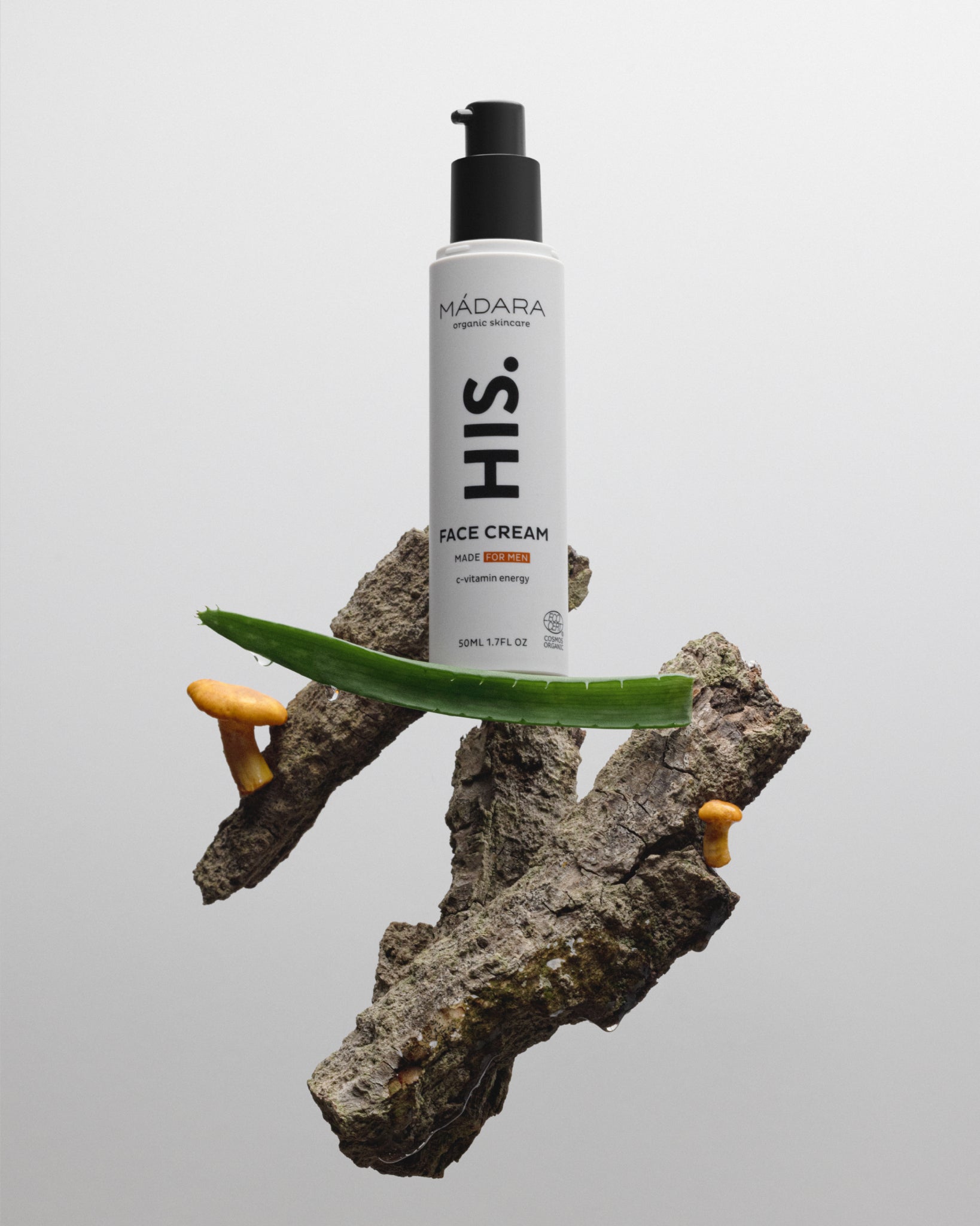 Model wearing MÁDARA Organic Skincare organic certified men face cream A5003 face cream on skin; close-up portrait shows natural application results.