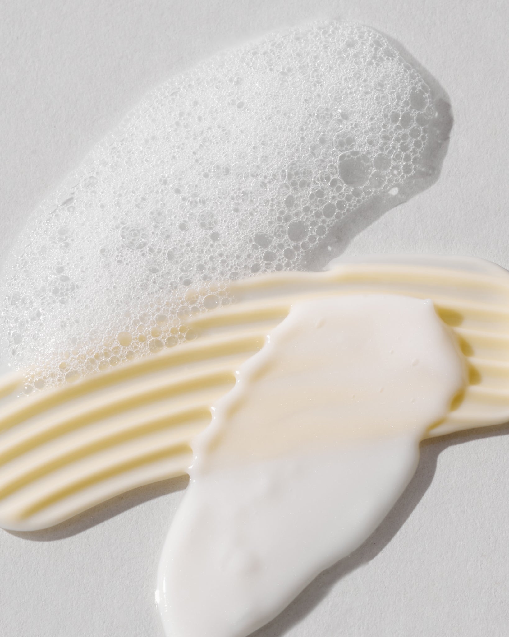 Texture close-up of MÁDARA Organic Skincare deeper than skin textures A0001 �swatch demonstrates consistency and finish.